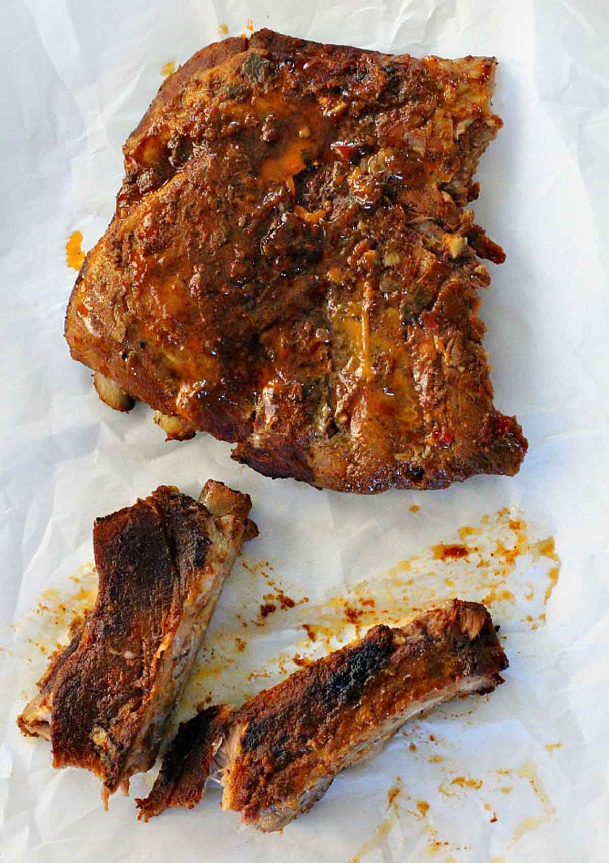Beef spare ribs cooked in the oven on a sheet pan.