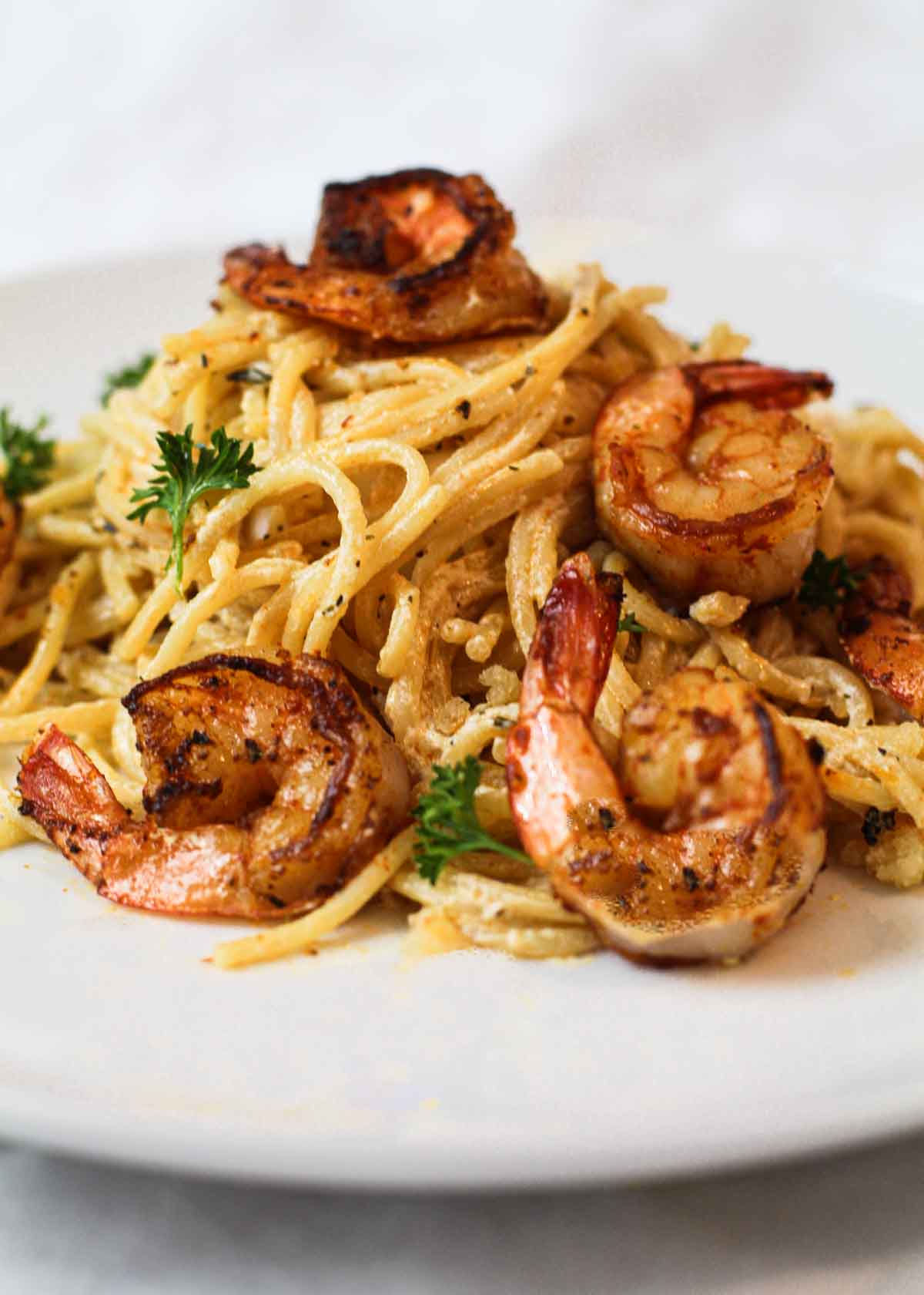 Spicy fried shrimp over pasta.