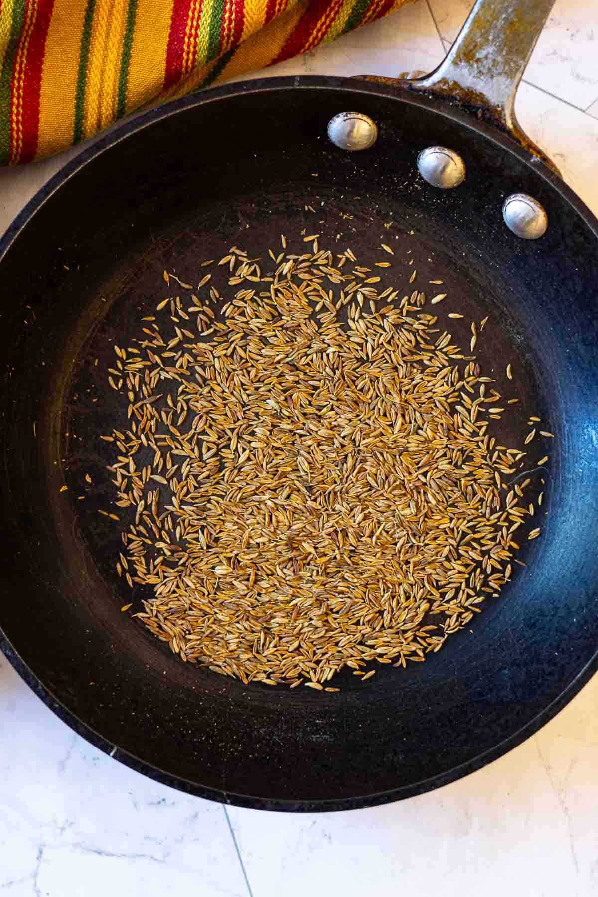 Step 1: Toasting cumin seeds to make homemade taco seasoning.