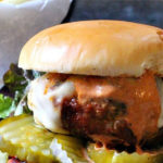 Buffalo Bill Burger made with Bison and Chorizo with a creamy BBQ sauce and a side of pickles and potato chips