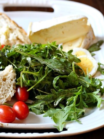 Arugula Salad with Truffle Oil and Balsamic Vinaigrette. Adding double cream cheese, bread and sliced hard boiled eggs makes this a light Summer meal.
