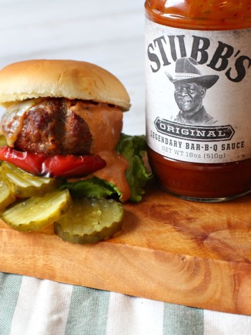 Stubbs BBQ Sauce burger recipe. Chorizo and bison burger with smoky BBQ cream sauce and caramelized red bell pepper rings.