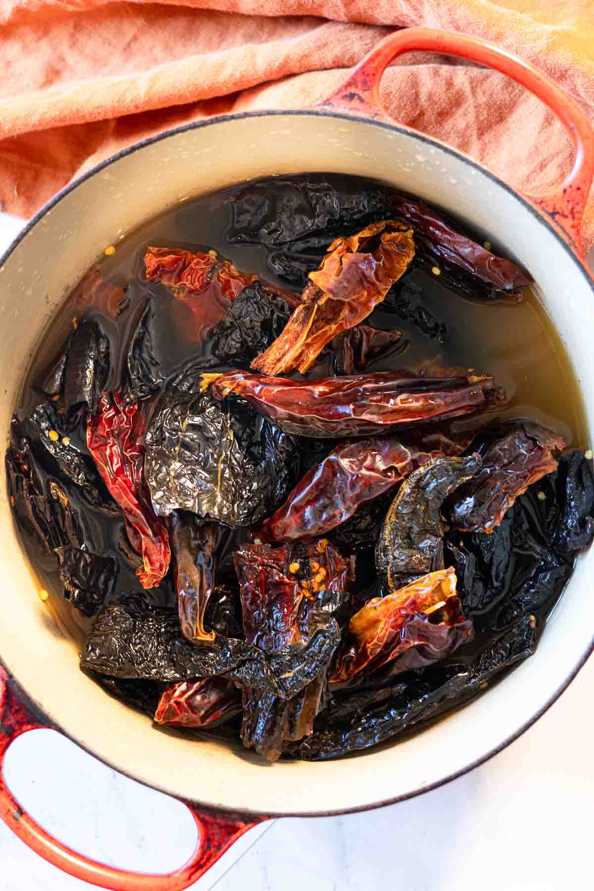 Step 4: cooking chile pods in chicken broth to make red chile sauce.