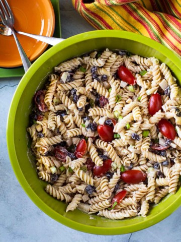 Pasta salad with black beans and cherry tomatoes.