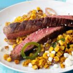 Mexican Flavored Corn topped with Grilled Flank Steak is an easy and healthy Summer meal.