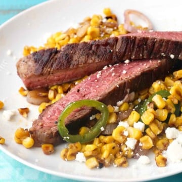 Grilled flank steak with mexican street corn.