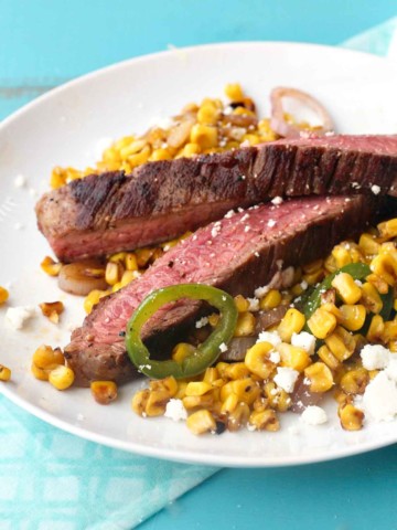 Grilled flank steak with mexican street corn.