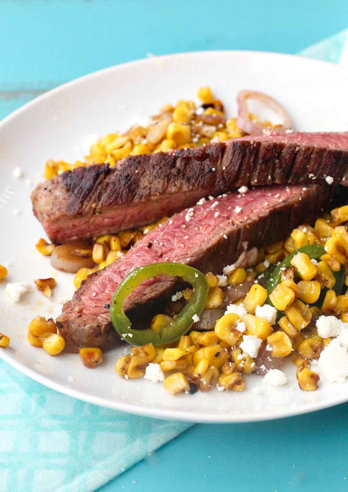 Grilled flank steak with mexican street corn.