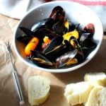 Steamed mussels in white wine pernod sauce served with French bread.