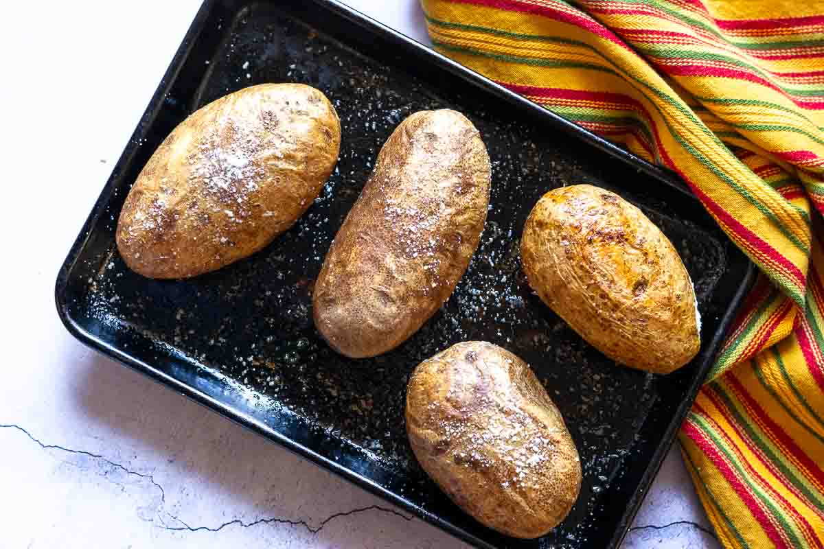 Roasting baked potatoes to make stuffed poblano peppers.