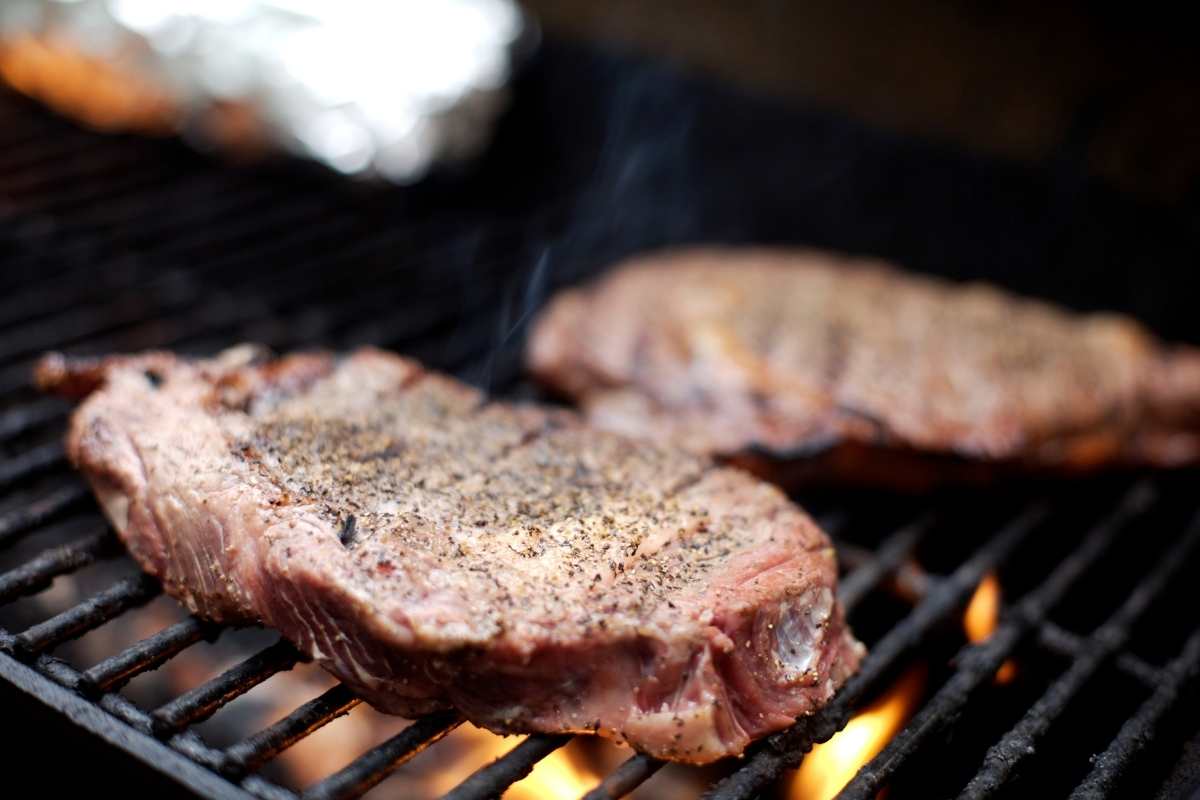 Ribeye steaks on the grill.