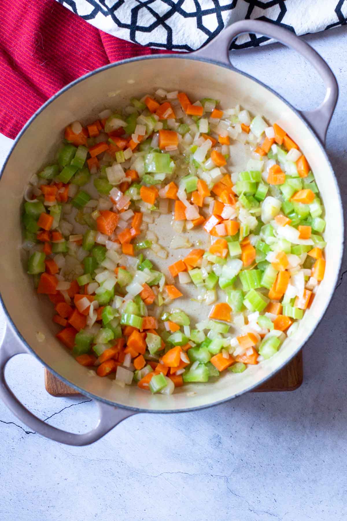 Cooking mirepoix in a Le Creuset Dutch Oven.