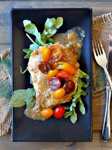 Fried chicken cutlets with cherry tomato cumin vinaigrette.