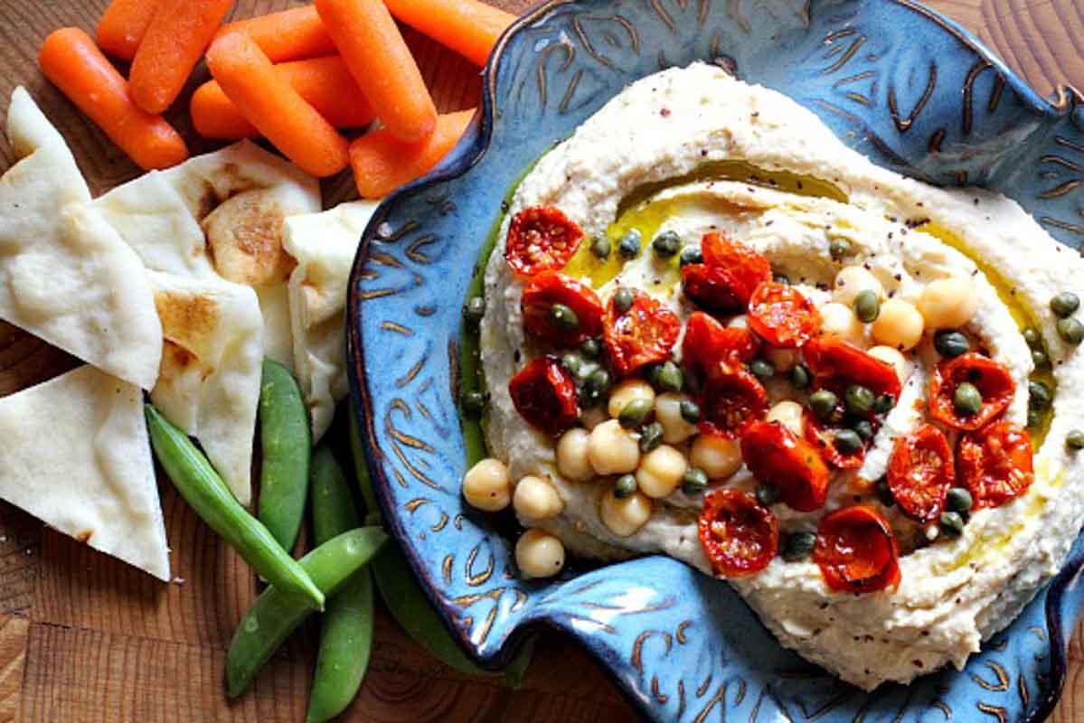 Homemade hummus topped with slow roasted cherry tomatoes.