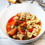 Butternut Squash Soup with Chicken in a white bowl.