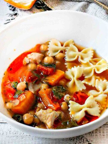 Butternut Squash Soup with Chicken in a white bowl.