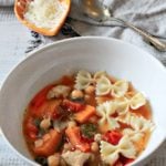 Chicken butternut squash pasta soup with parmesan cheese for topping.