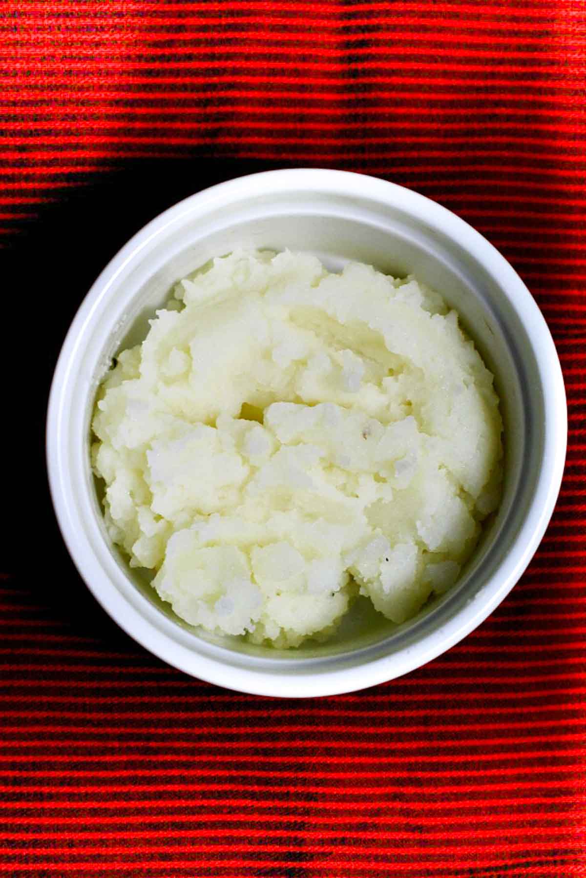 Mashed potatoes in a ramekin.