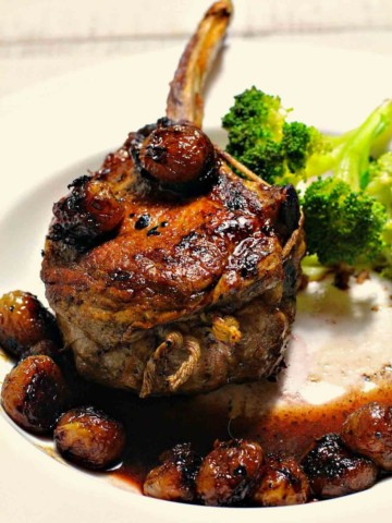 Pan roasted veal chops with roasted grapes.