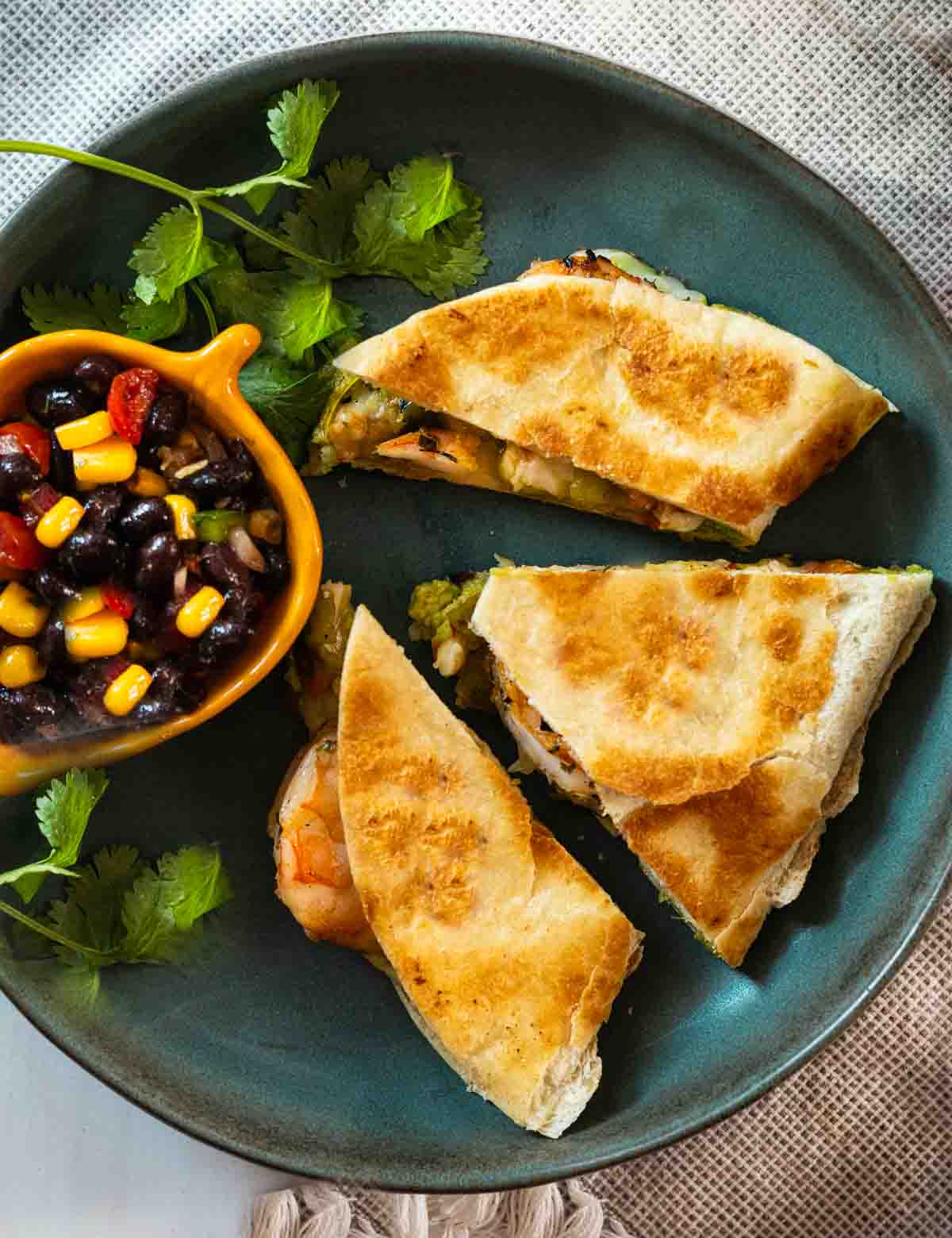 Shrimp Quesadillas with avocado, green chile peppers and melted cheese.