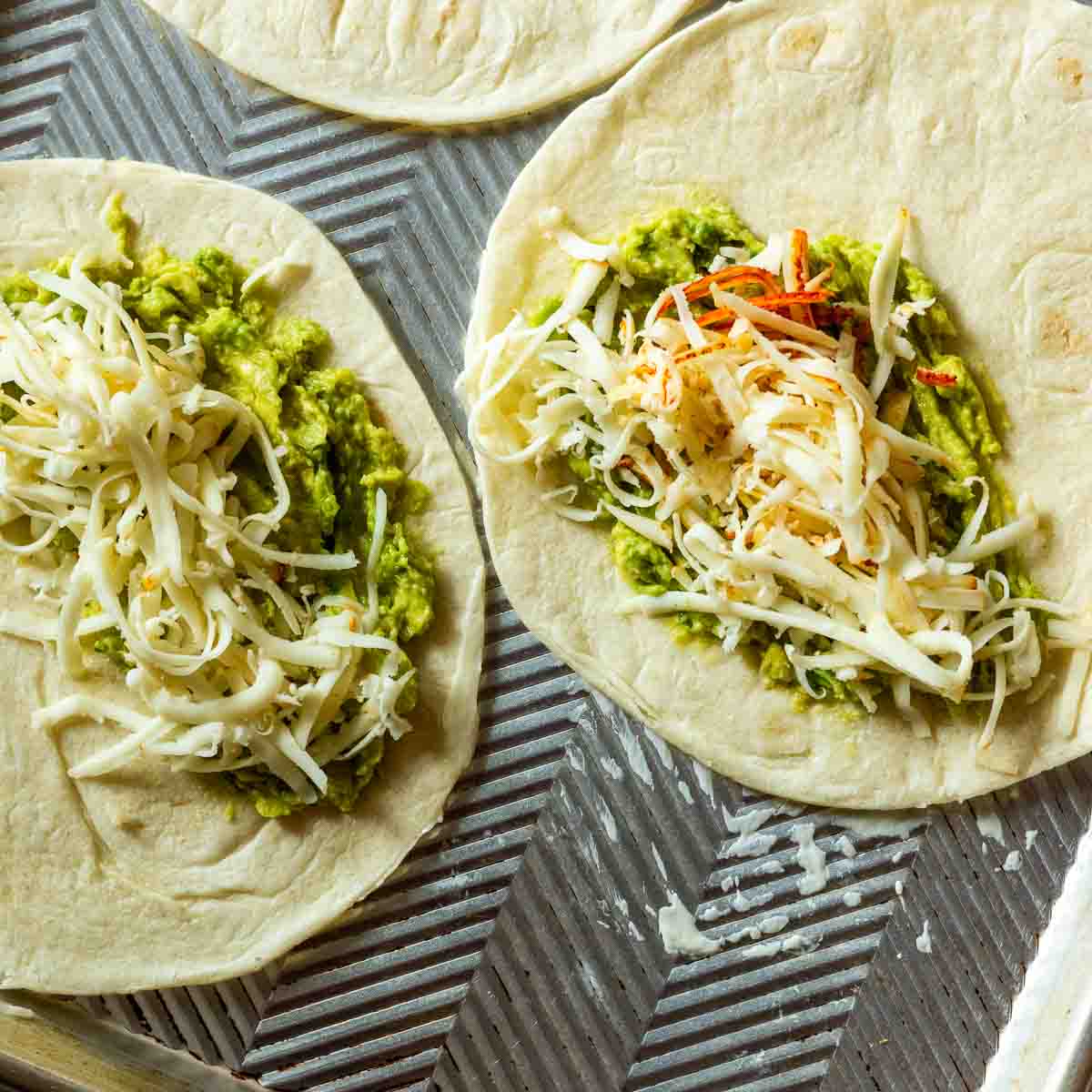 Adding cheese to flour tortillas make shrimp quesadillas.