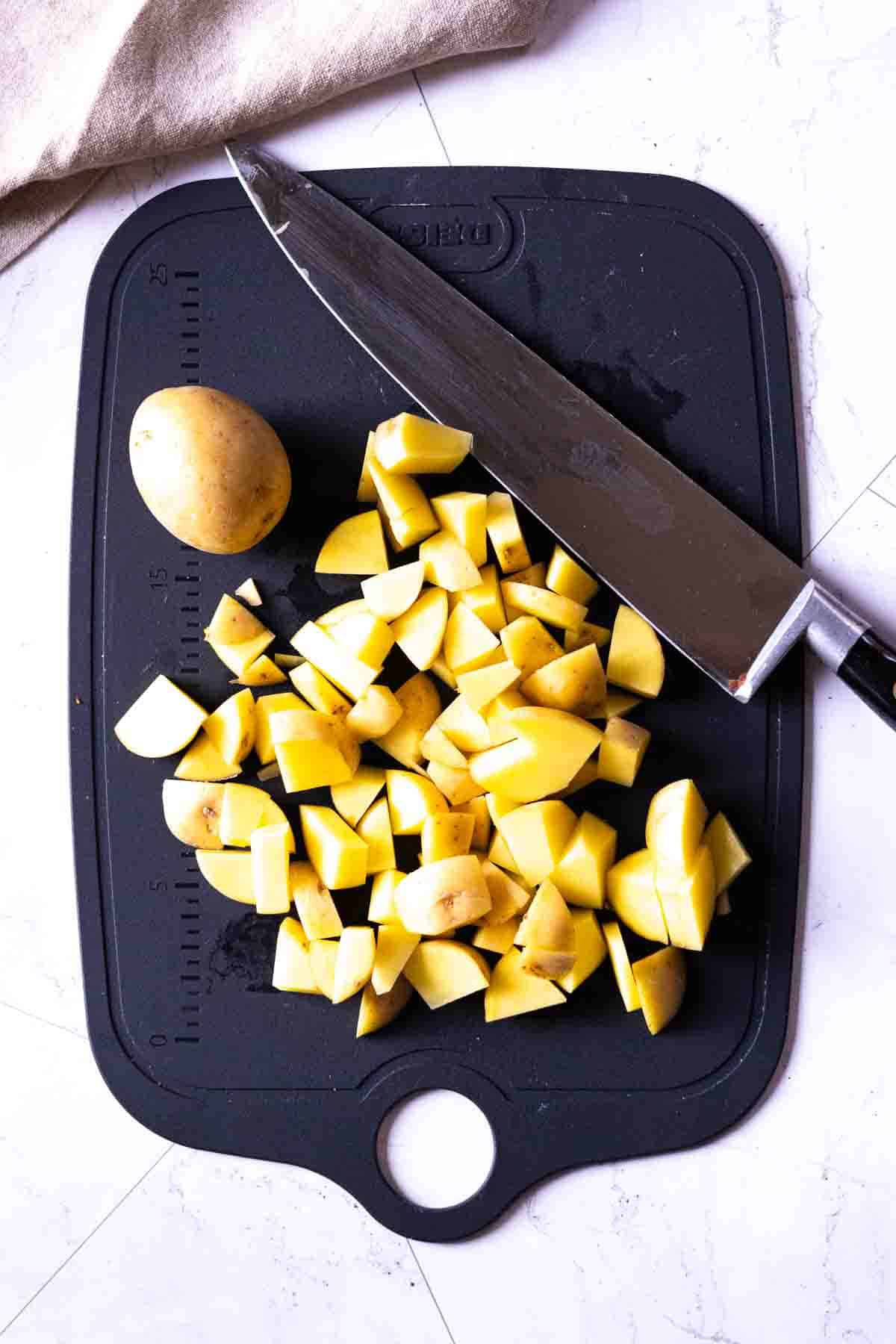Cutting potatoes to make chorizo tacos, step 1.