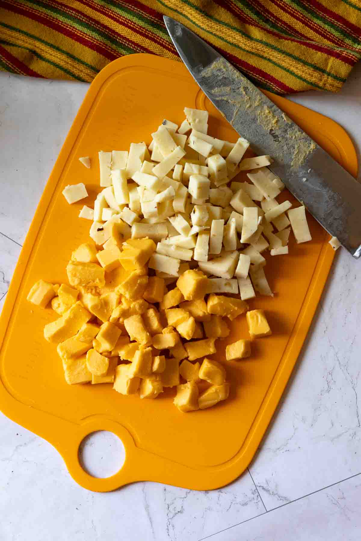 Step 2: Cubed cheese to make chipotle macaroni and cheese with pasta.