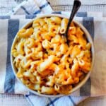 A bowl of chipotle mac and cheese with chicken.