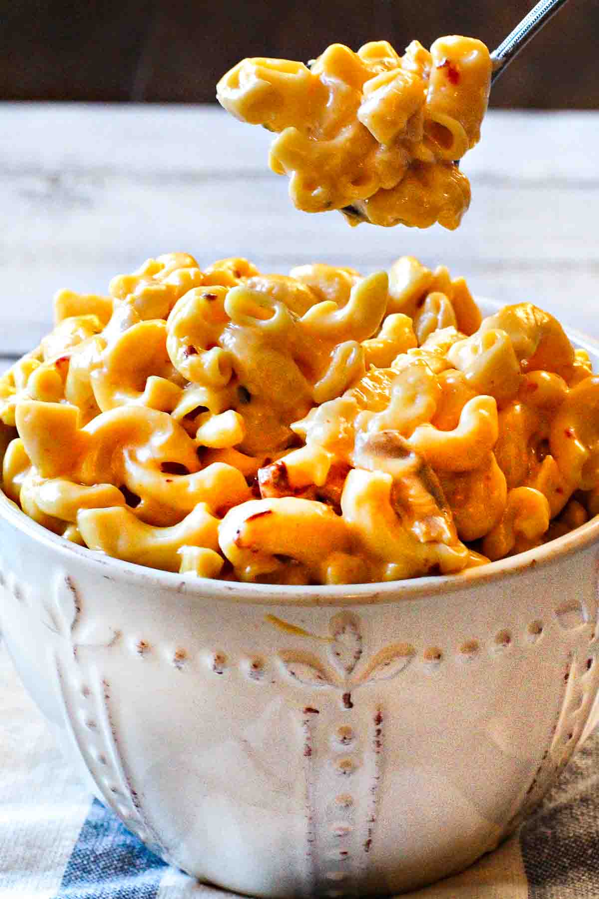 Chipotle mac and cheese in a rustic bowl.