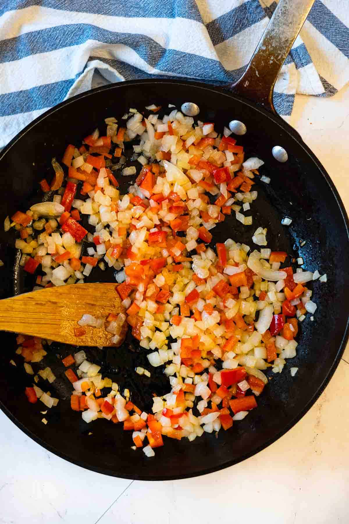 Step 5: sauteeing vegetables to make chicken and vegetable soup.