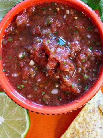 Mexican restaurant salsa in a bowl served with tortilla chips.