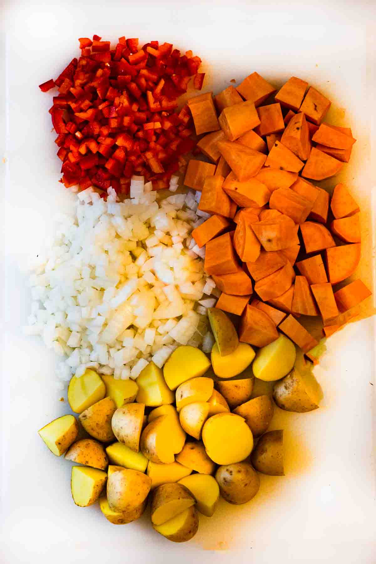 Chopped vegetables for chicken and vegetable soup with white wine.