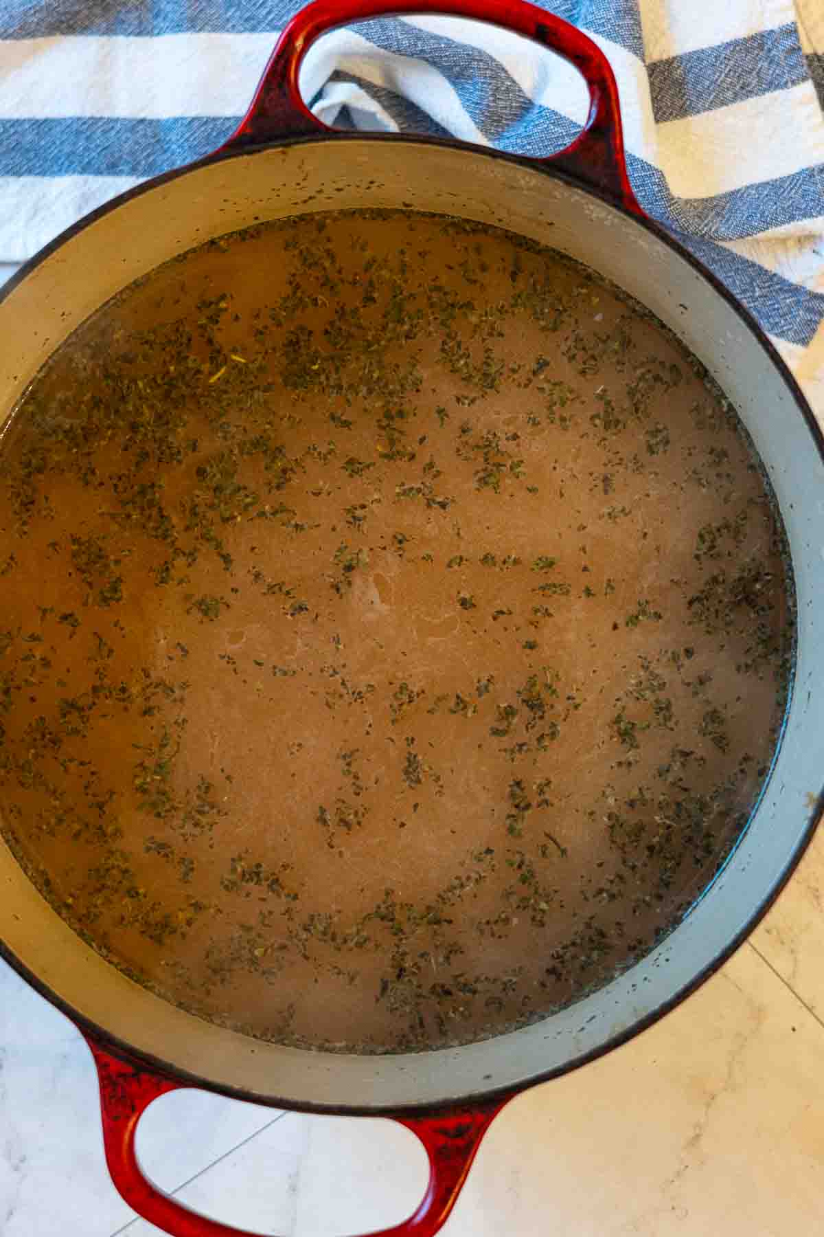 Step 3: Making white wine broth for chicken and vegetable soup.