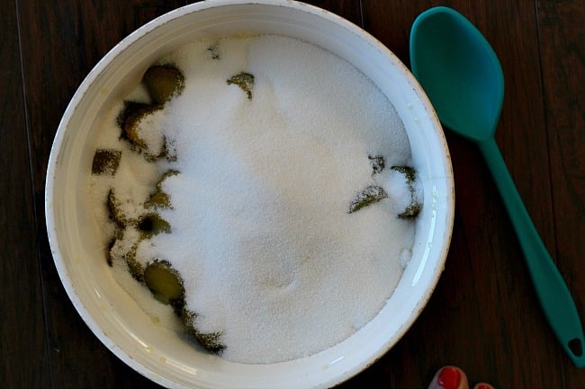 Sliced dill pickles covered in sugar to make homemade best spicy pickles.