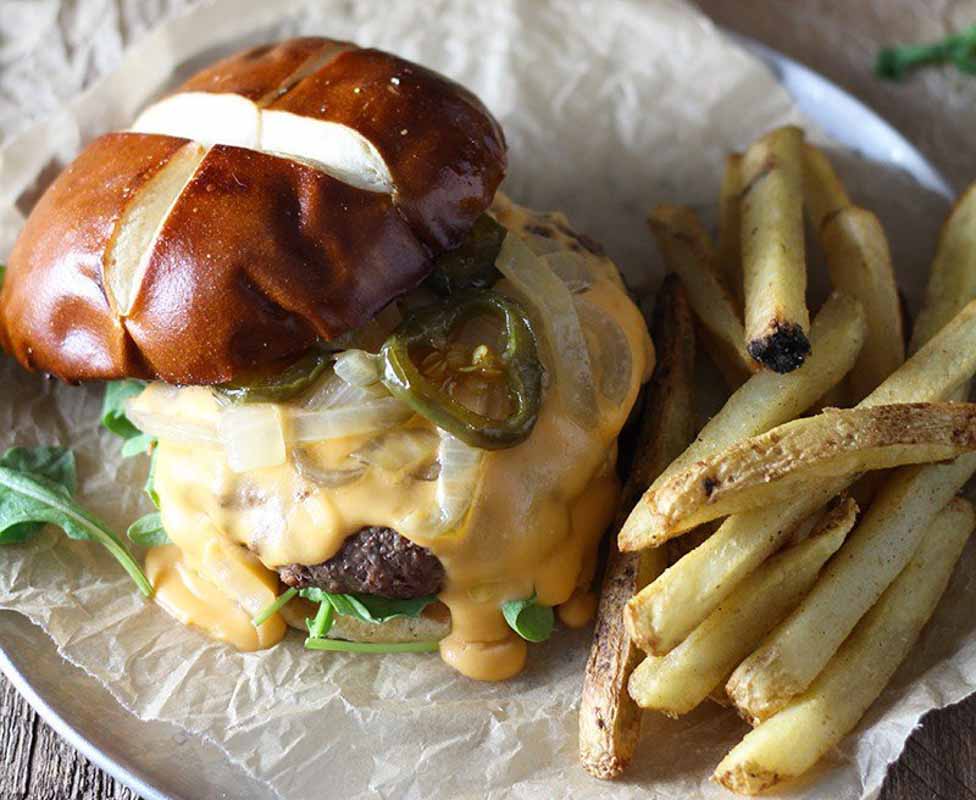 Beer cheese burger with french fries.