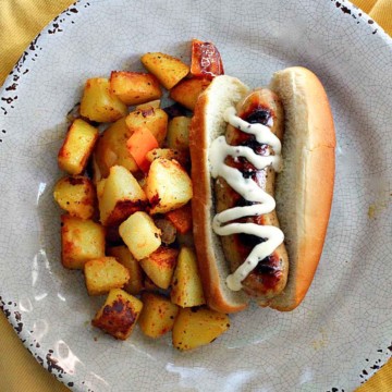 Chicken apple sausage hotdogs served with fried cubed potatoes.