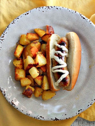 Chicken apple sausage hotdogs served with fried cubed potatoes.