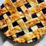 Fresh cherry pie with homemade lattice pie crust in a 9 inch tart pan.