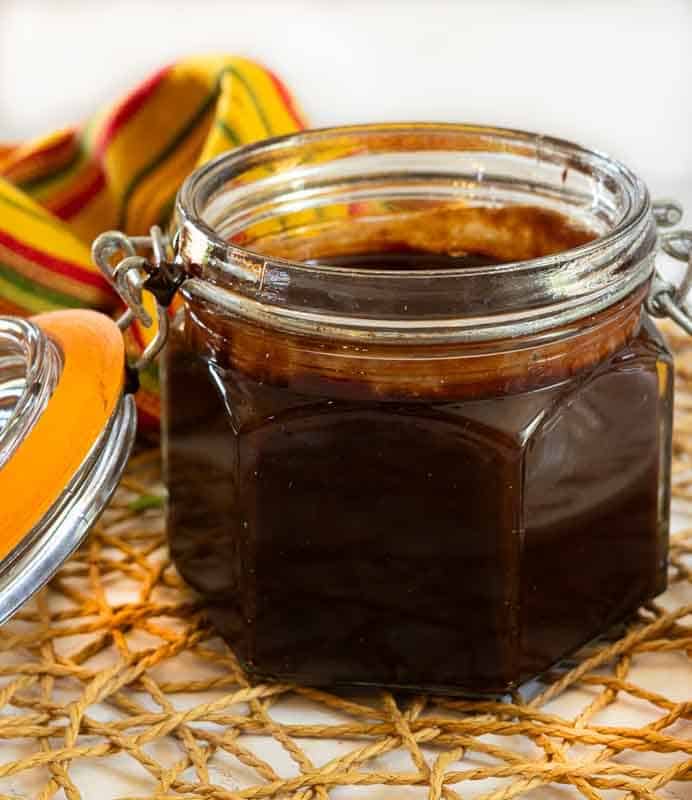 Storing Mexican Chocolate Sauce in a glass container.