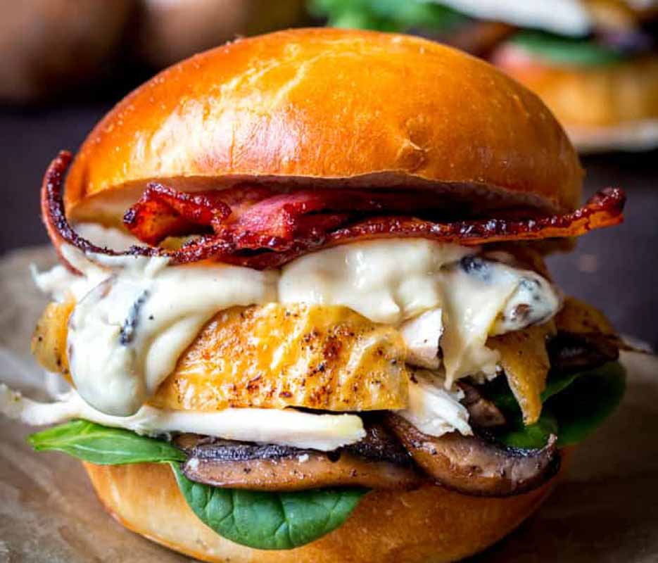 Roast chicken burger on a brioche bun.