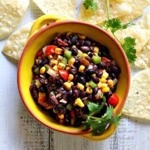 Black bean corn salsa dip in a yellow bowl.