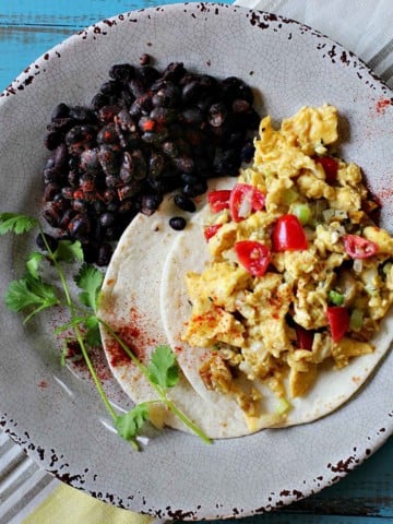Mexican breakfast scrambled eggs with black beans.