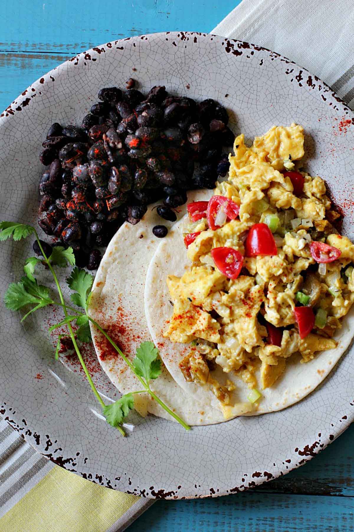 Mexican breakfast scrambled eggs with black beans.