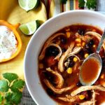Mexican Chicken Soup Recipe made in the Pressure Cooker. Served with lime and sour cream.