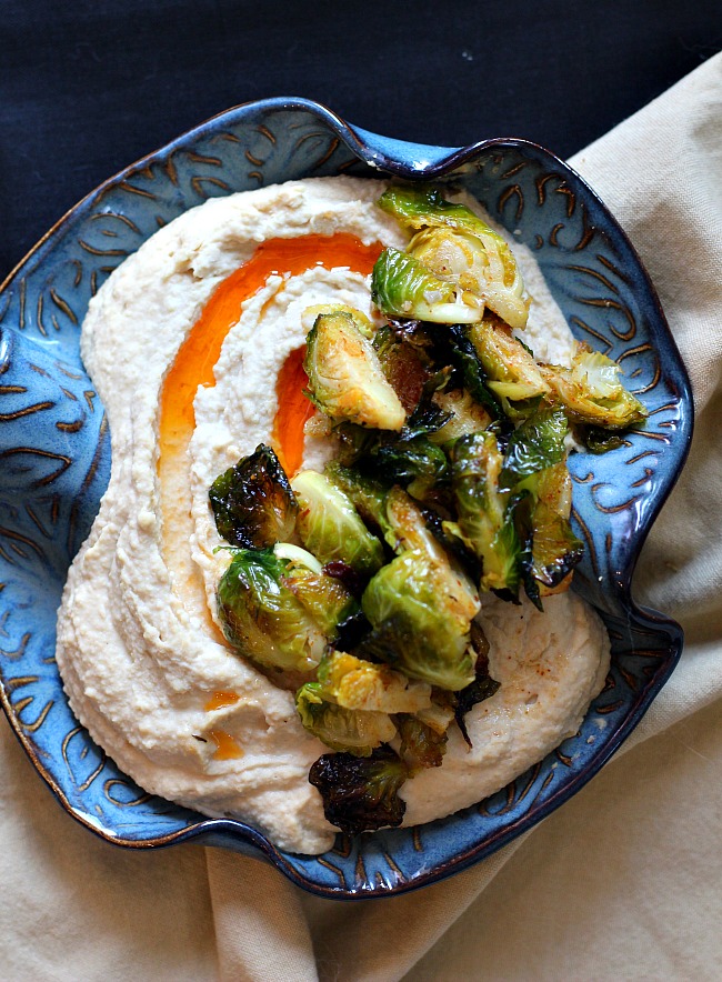 Hummus with roasted brussels sprouts recipe served in a Hilbom bowl