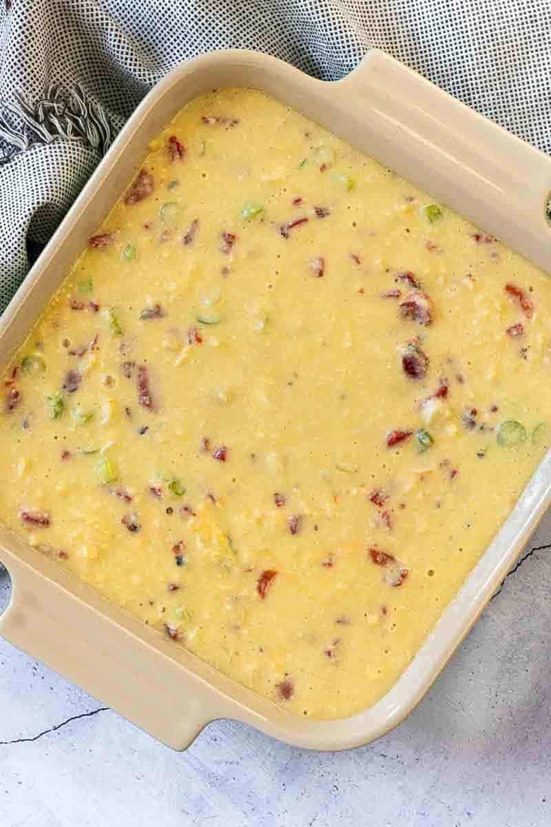 Italian Breakfast Casserole in an 8 x 8 casserole dish ready to bake.