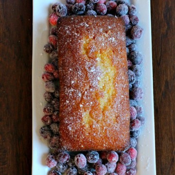 Orange pound cake with orange glaze and sugared cranberries