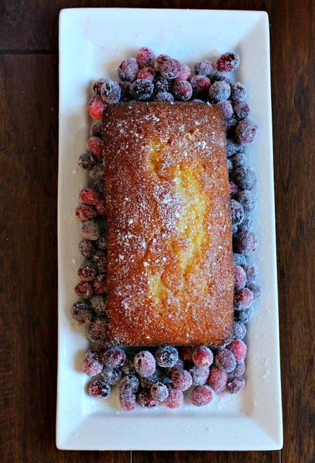 Orange pound cake with orange glaze and sugared cranberries