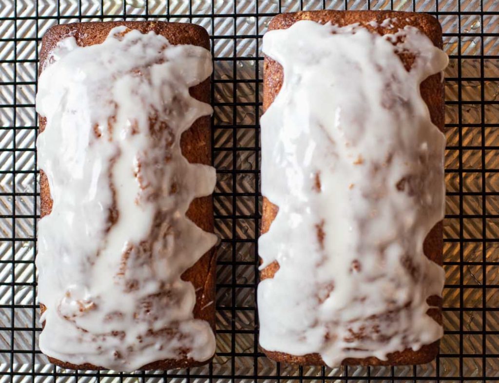 Frosted Orange Pound Cakes on a wire rack