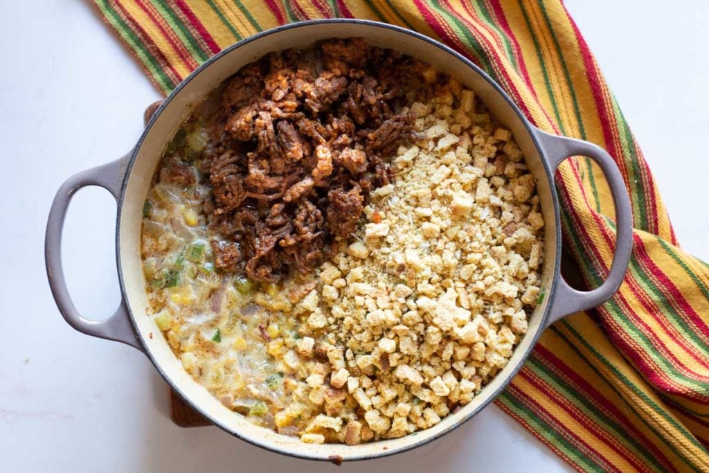 adding cornbread and chorizo to make chorizo stuffing